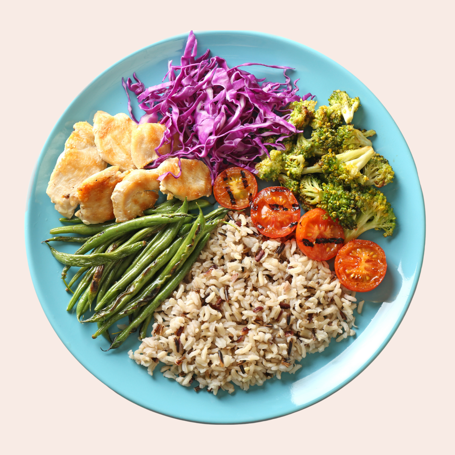Colorful plate with wild rice, string bean, roasted tomatoes, broccoli, purple cabbage and chicken.