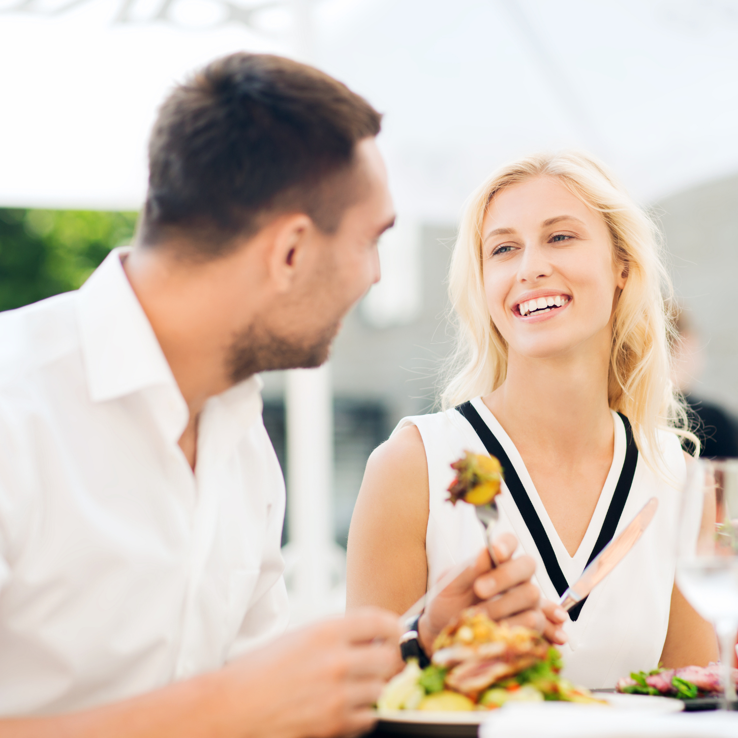 Man and woman eating.
